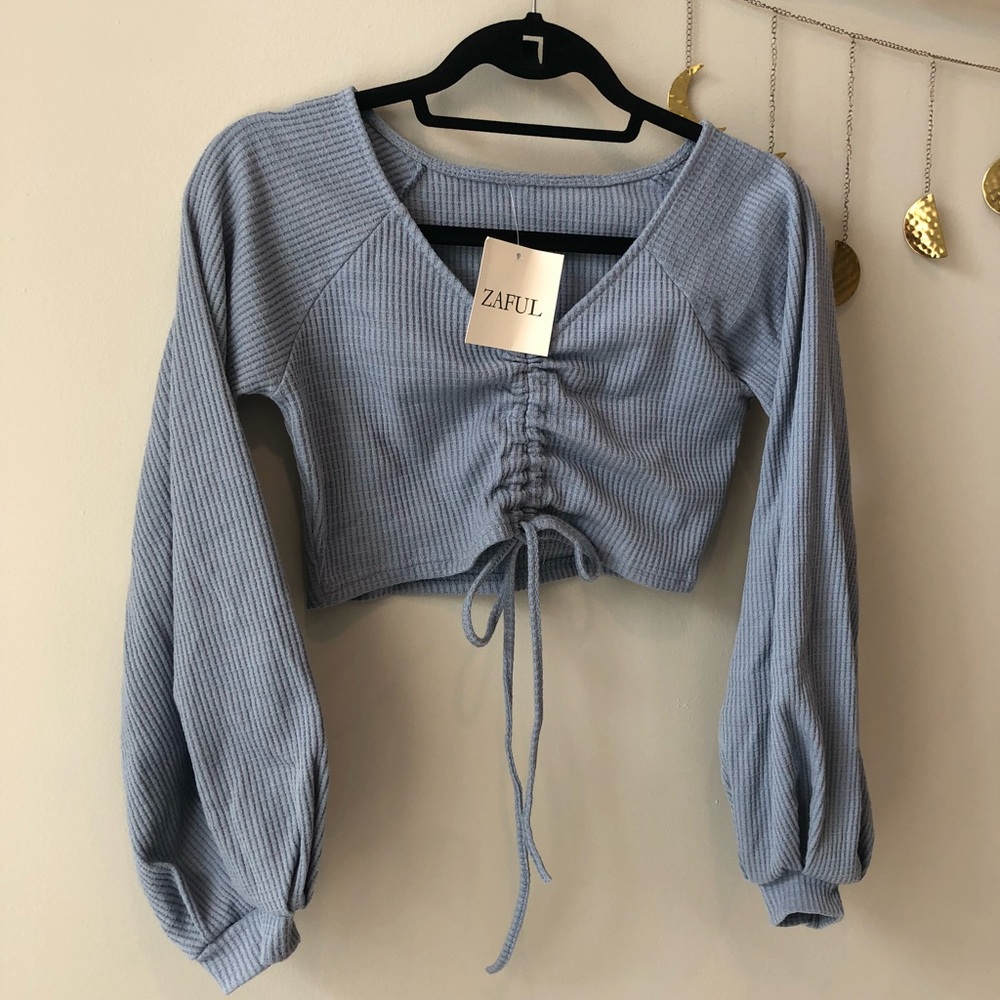 Cropped blue-gray bell-sleeved top